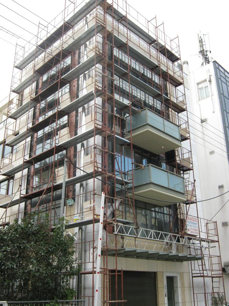 Scaffolding for balcony repairs on an apartment building