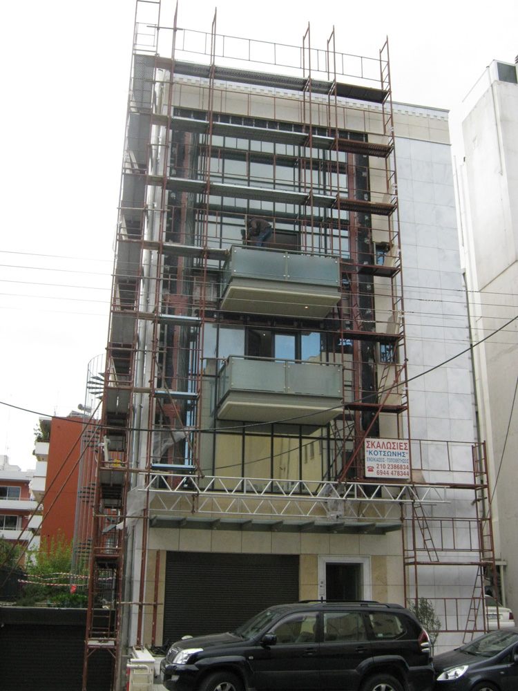 Scaffolding for balcony repairs on an apartment building