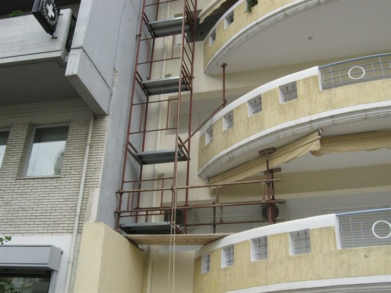 Scaffolding for balcony repairs on an apartment building