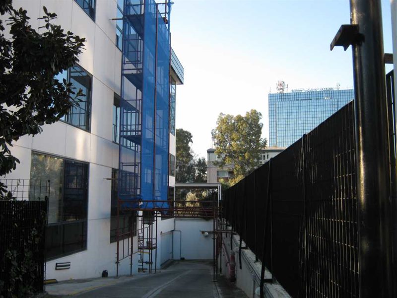 Scaffolding with blue safety netting on an apartment building
