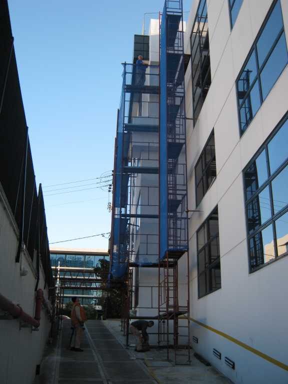 Scaffolding with blue safety netting on an apartment building