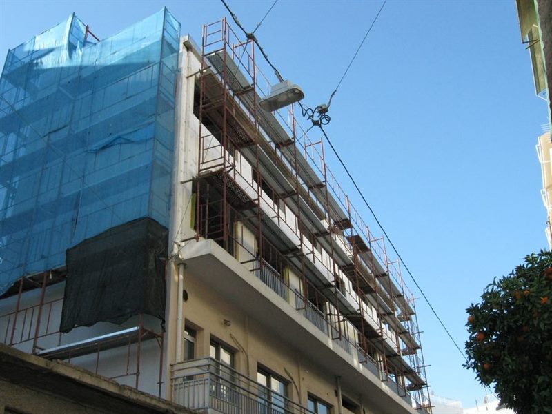 Scaffolding with blue safety netting on an apartment building