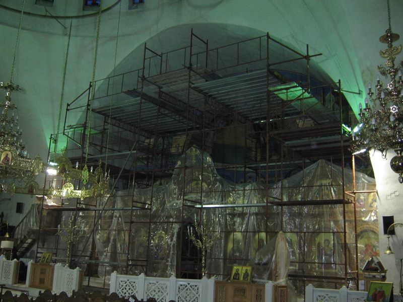 Scaffolding in front of a church iconostasis