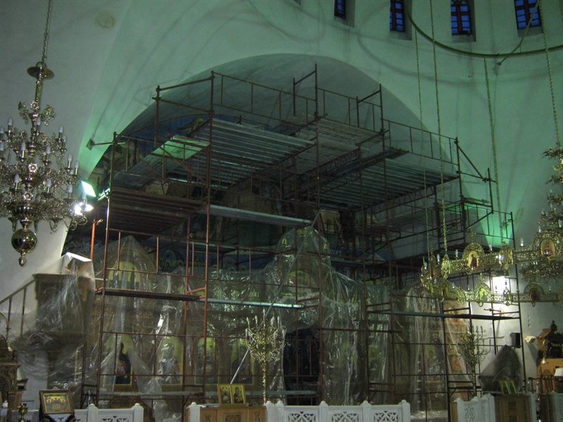 Scaffolding in front of a church iconostasis