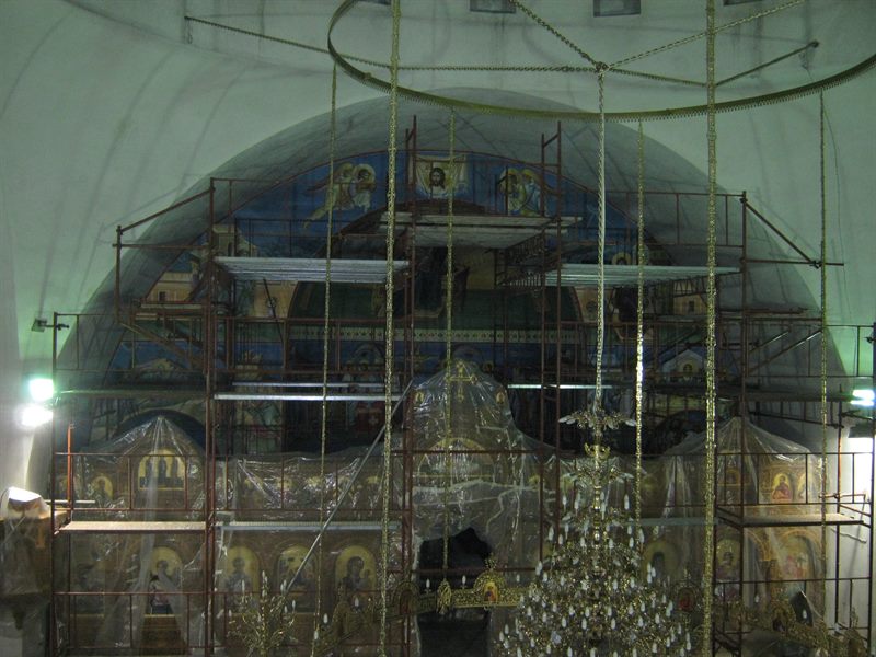 Scaffolding in front of a church iconostasis