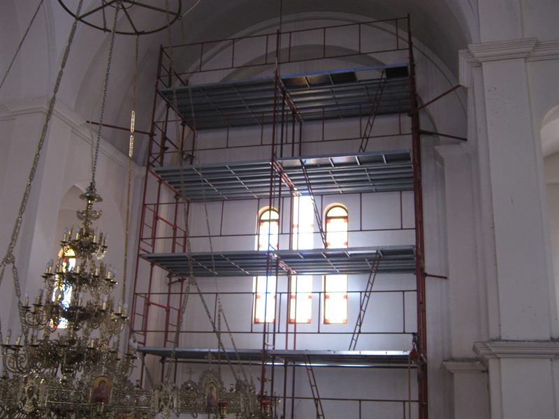 Scaffolding around a church chandelier