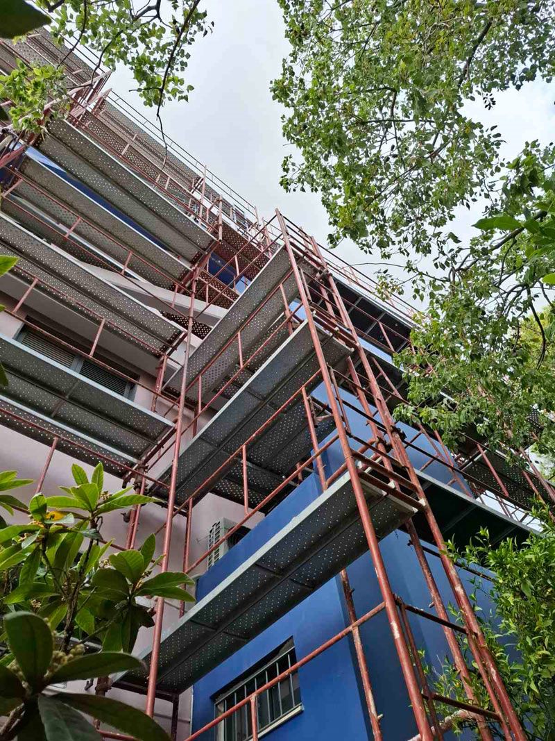 Scaffolding for balcony repairs on an apartment building