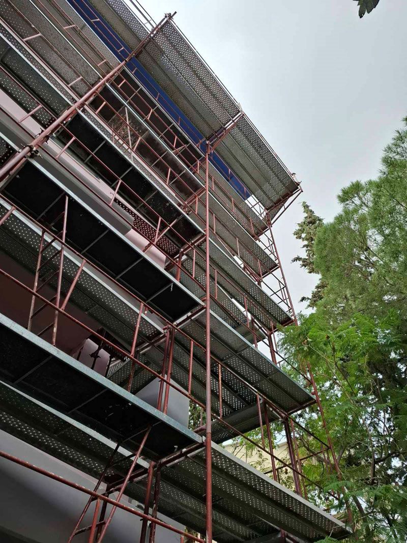 Scaffolding for balcony repairs on an apartment building