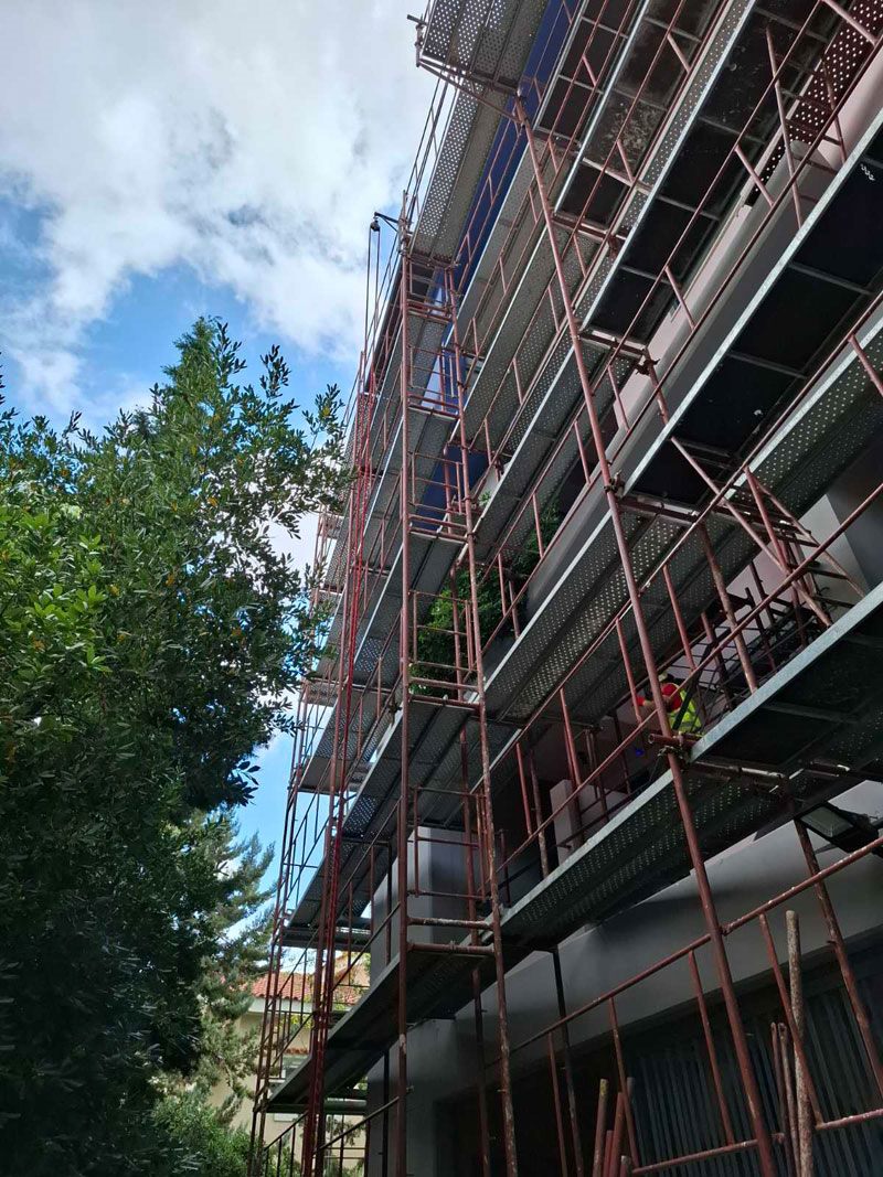 Scaffolding for balcony repairs on an apartment building