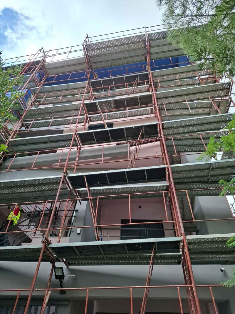 Scaffolding for balcony repairs on an apartment building
