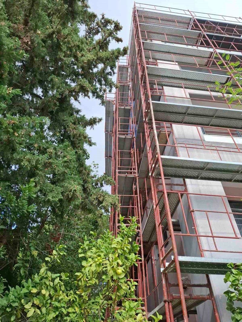 Scaffolding for balcony repairs on an apartment building