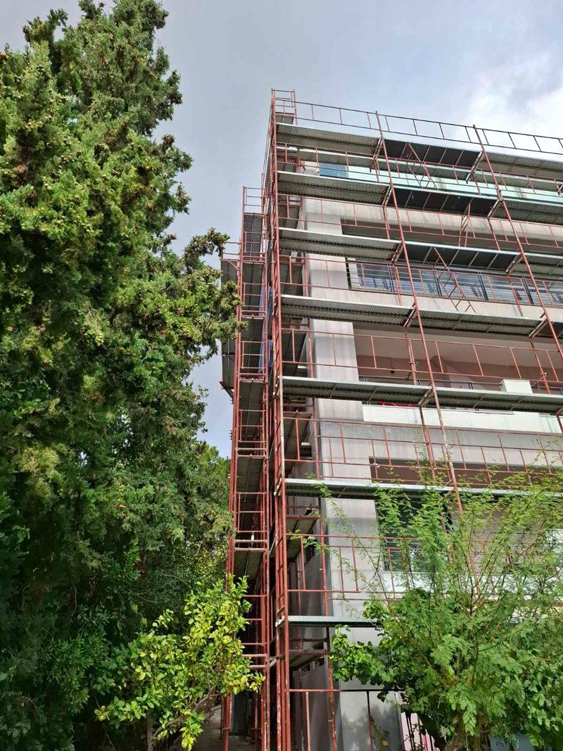 Scaffolding for balcony repairs on an apartment building