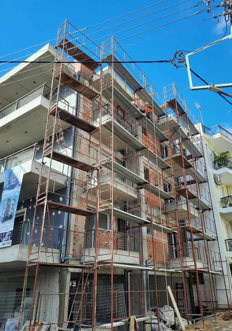 Scaffolding for balcony repairs on an apartment building