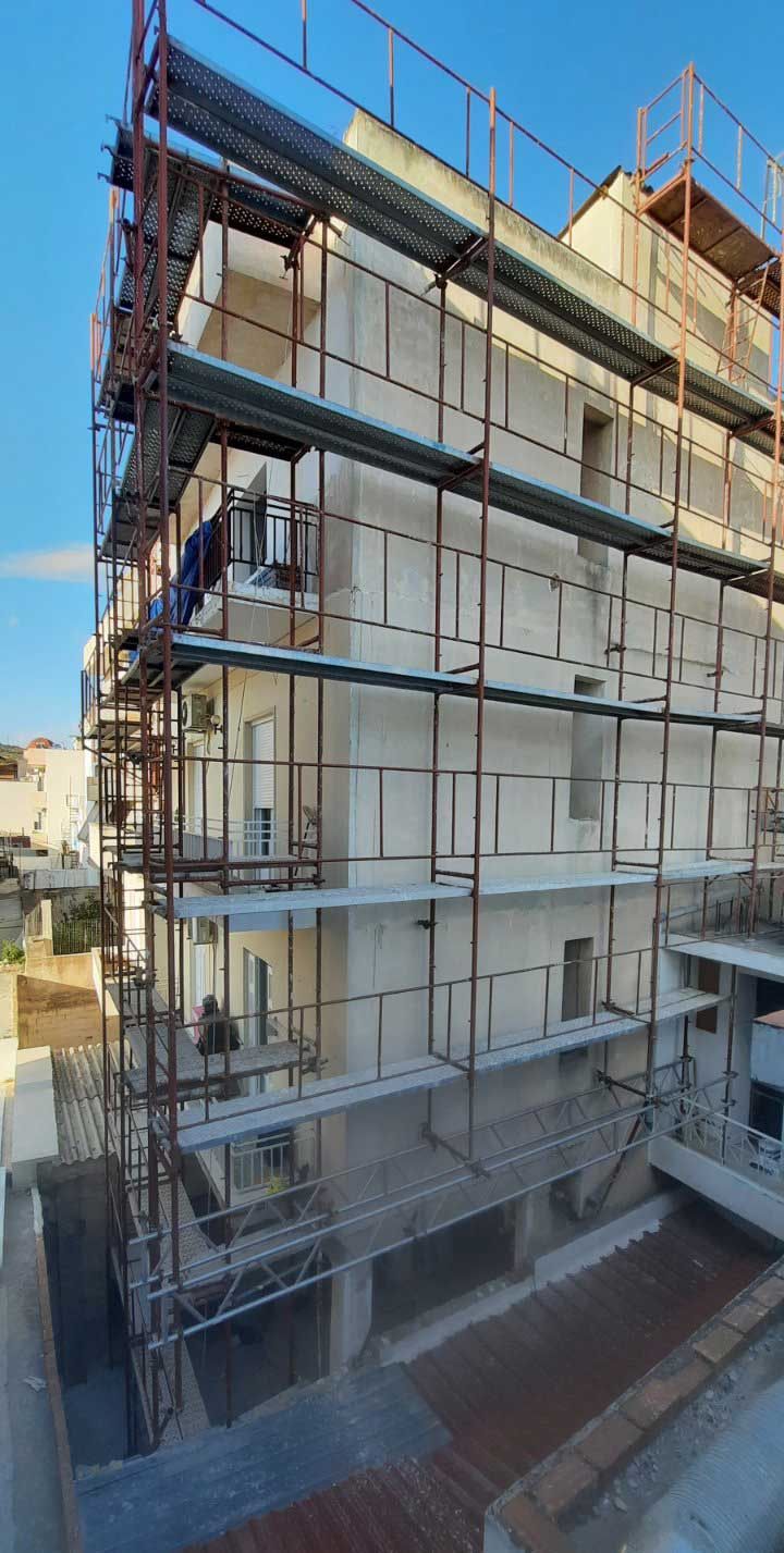 Scaffolding for balcony repairs on an apartment building