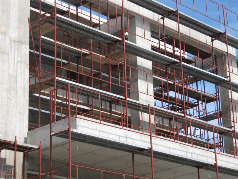 Scaffolding for balcony repairs on an apartment building