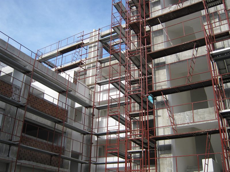 Scaffolding for balcony repairs on an apartment building