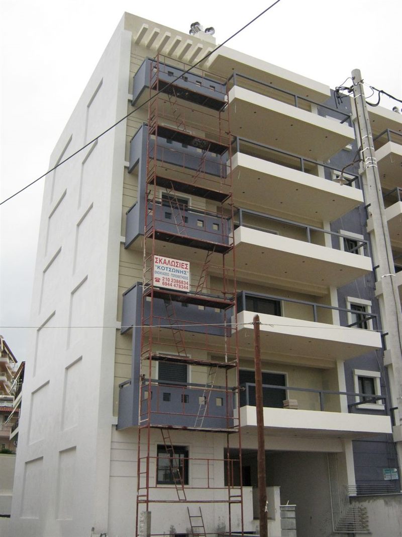 Scaffolding for balcony repairs on an apartment building