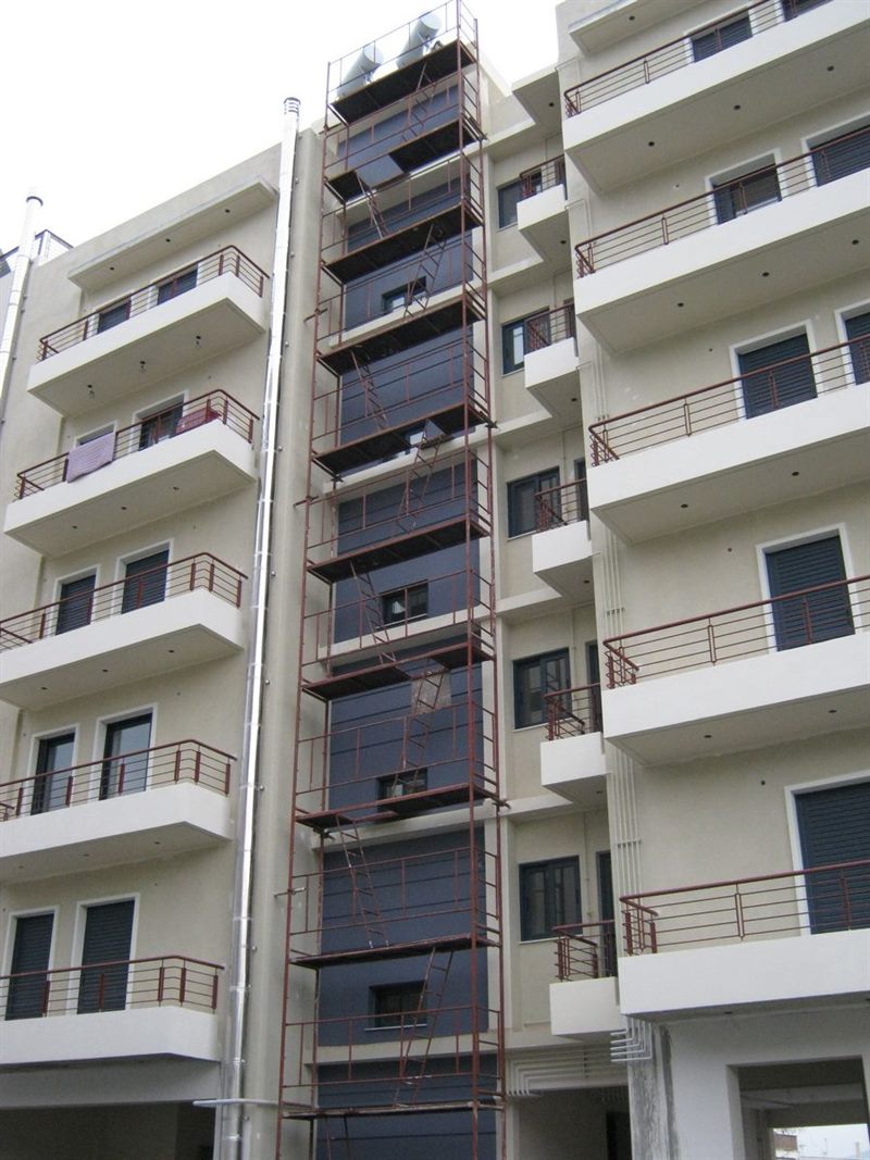 Scaffolding for balcony repairs on an apartment building