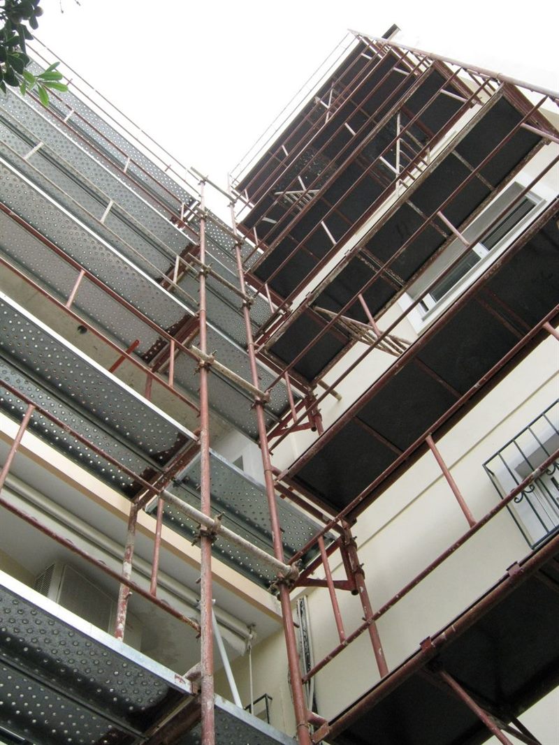 Scaffolding for balcony repairs on an apartment building