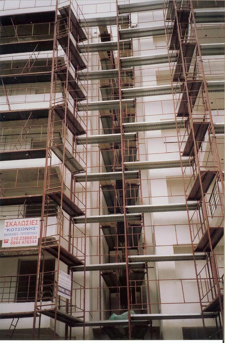 Scaffolding for balcony repairs on an apartment building