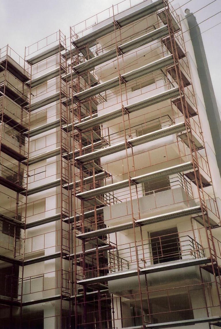 Scaffolding for balcony repairs on an apartment building