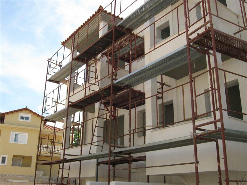 Scaffolding for balcony repairs on an apartment building