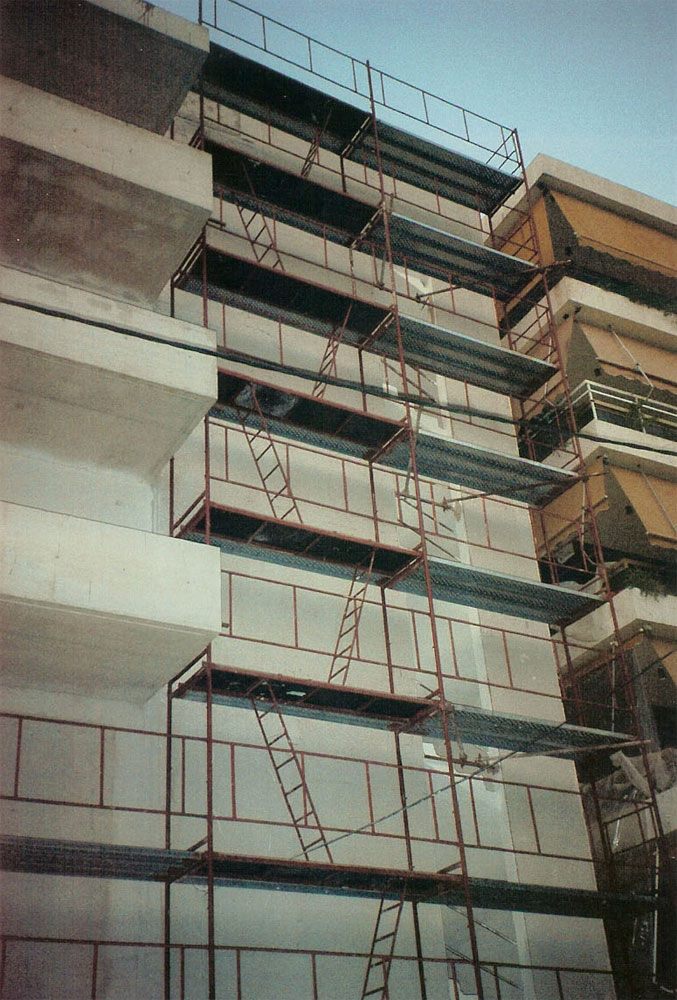 Scaffolding for balcony repairs on an apartment building