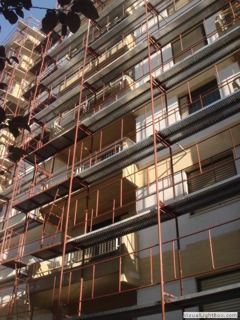 Scaffolding for balcony repairs on an apartment building