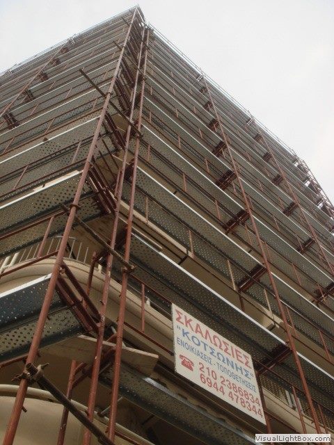 Scaffolding for balcony repairs on an apartment building