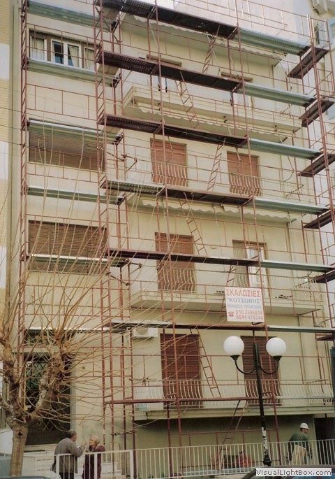 Scaffolding for balcony repairs on an apartment building