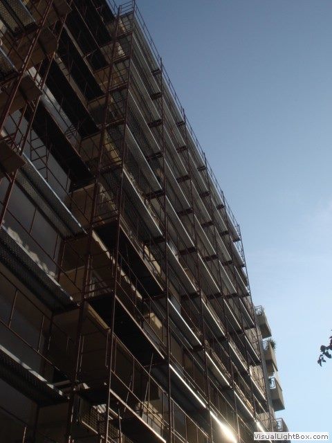 Scaffolding for balcony repairs on an apartment building