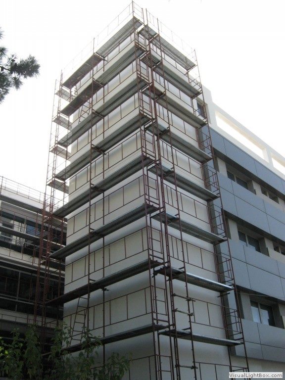 Scaffolding for balcony repairs on an apartment building