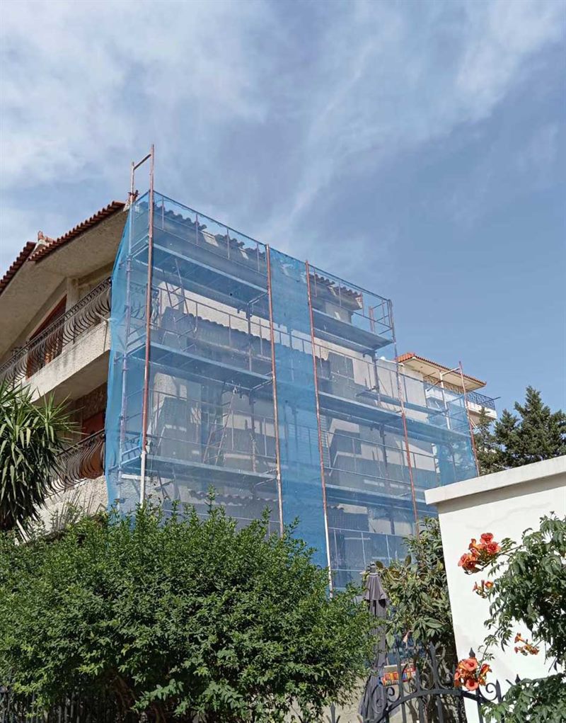 Scaffolding with blue safety netting on an apartment building