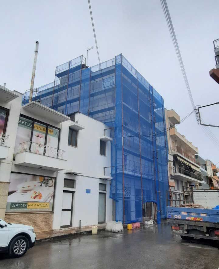 Scaffolding with blue safety netting on an apartment building