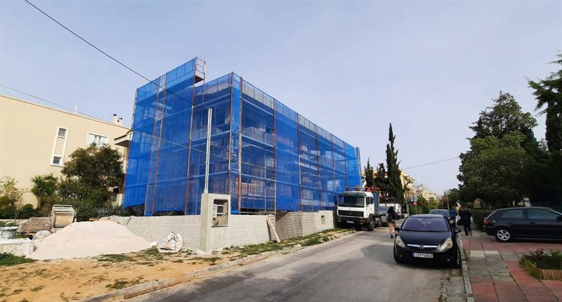 Scaffolding with blue safety netting on an apartment building