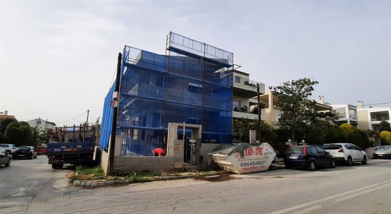 Scaffolding with blue safety netting on an apartment building