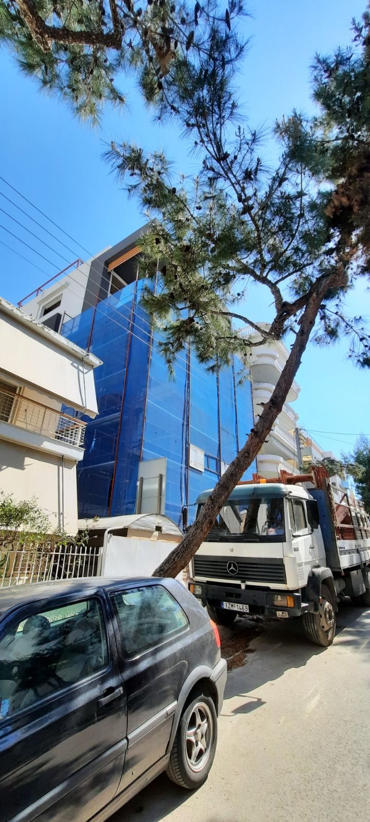 Scaffolding with blue safety netting on an apartment building