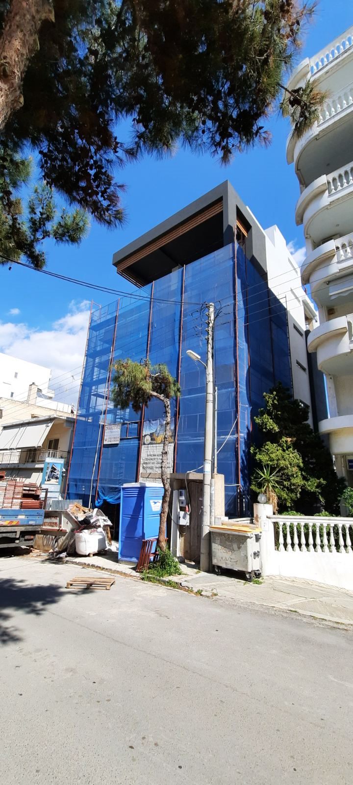 Scaffolding with blue safety netting on an apartment building