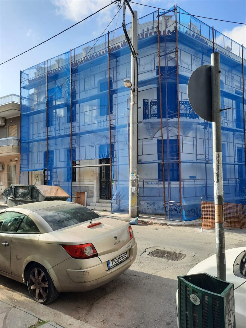 Scaffolding with blue safety netting on an apartment building