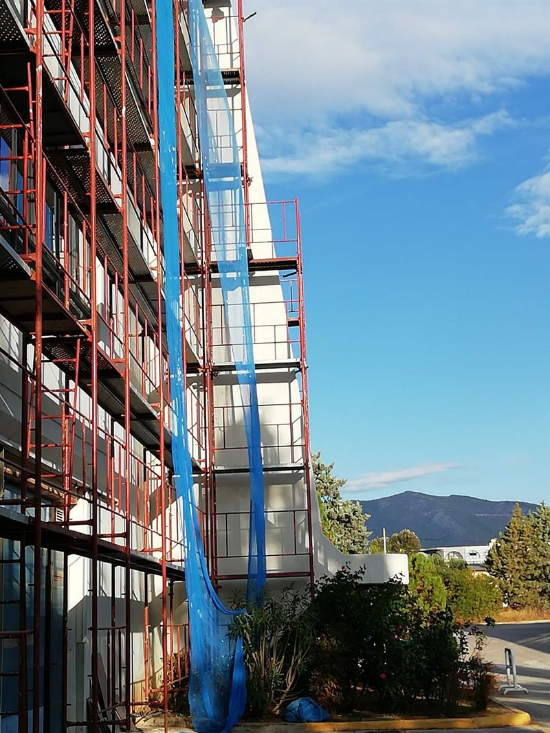 Scaffolding with blue safety netting on an apartment building