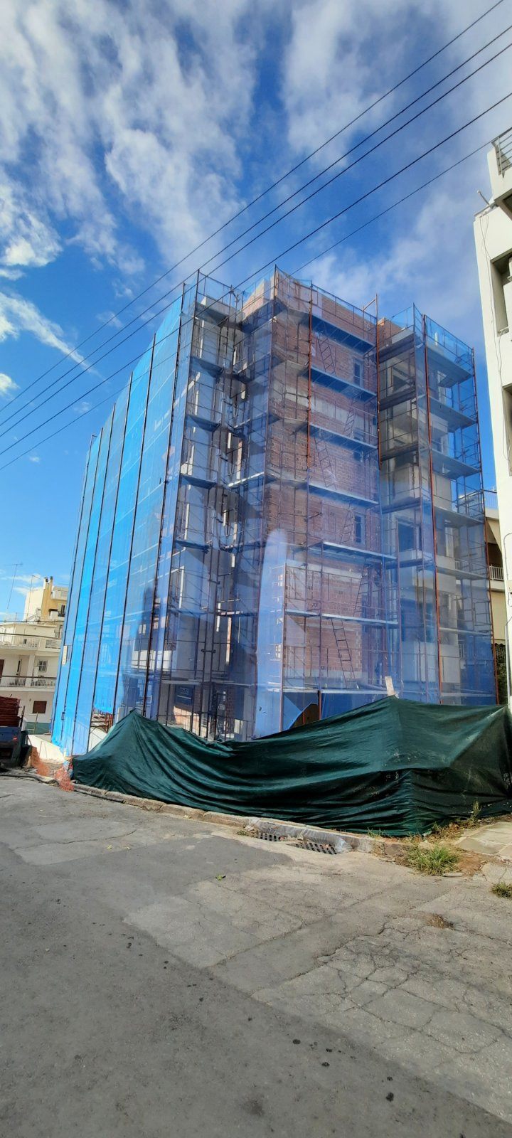 Scaffolding with blue safety netting on an apartment building