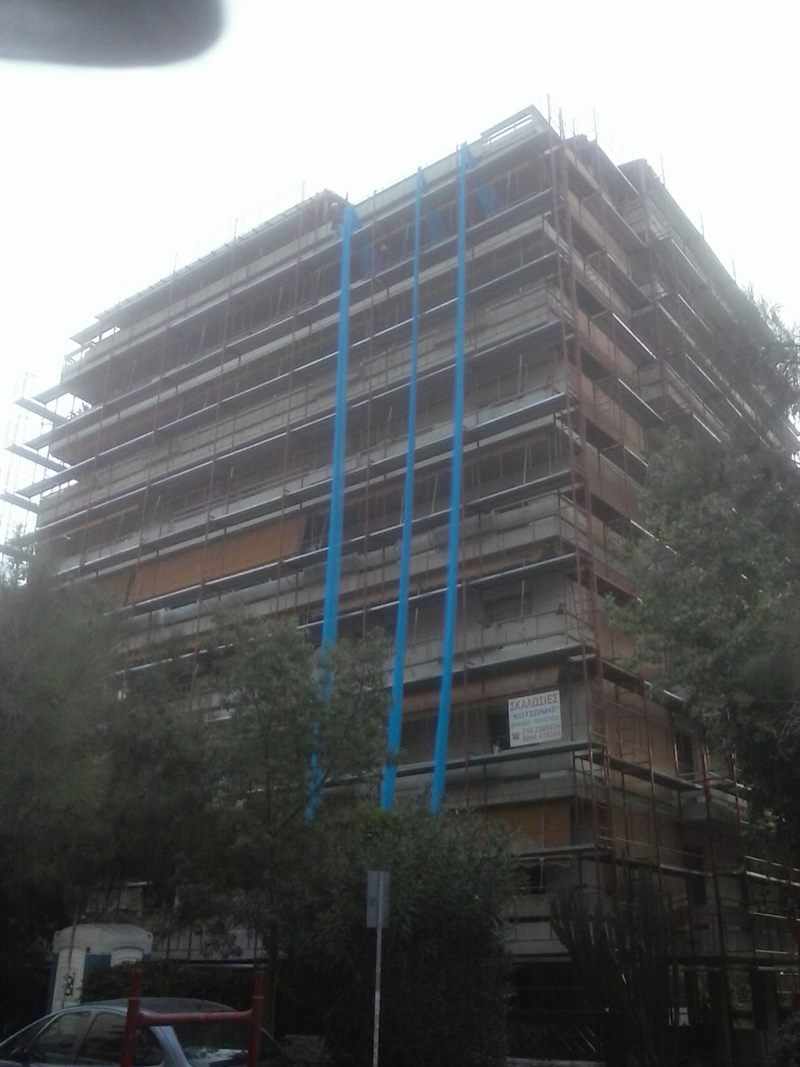 Scaffolding with blue safety netting on an apartment building