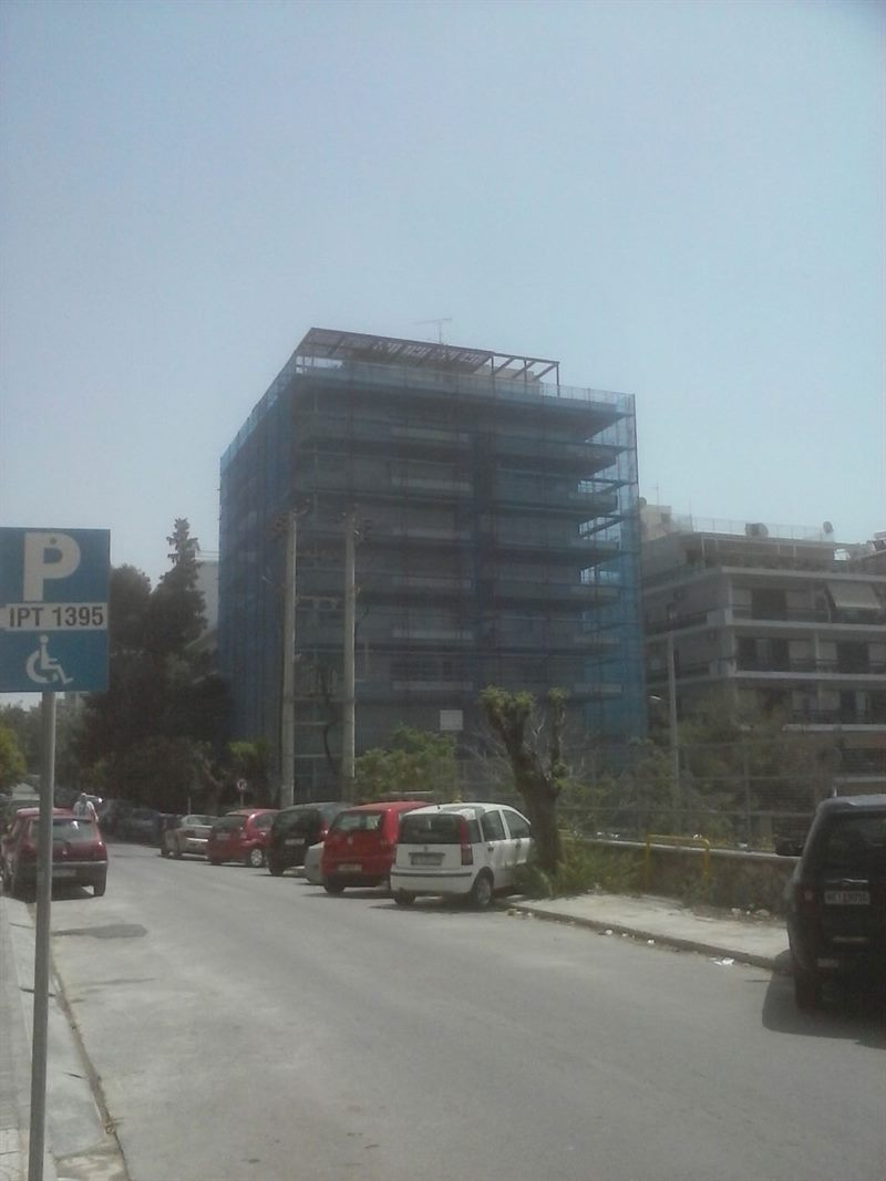 Scaffolding with blue safety netting on an apartment building