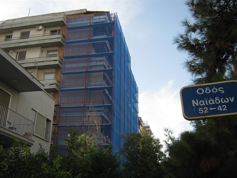 Scaffolding with blue safety netting on an apartment building