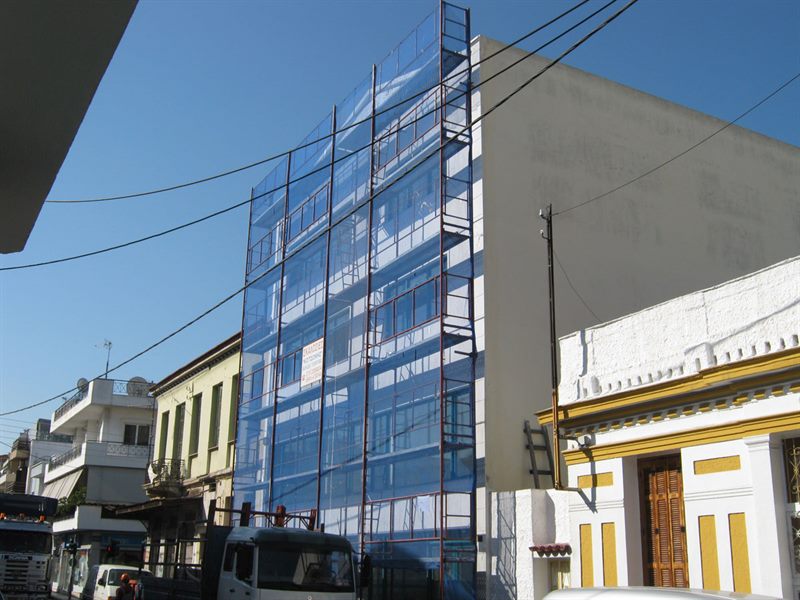 Scaffolding with blue safety netting on an apartment building