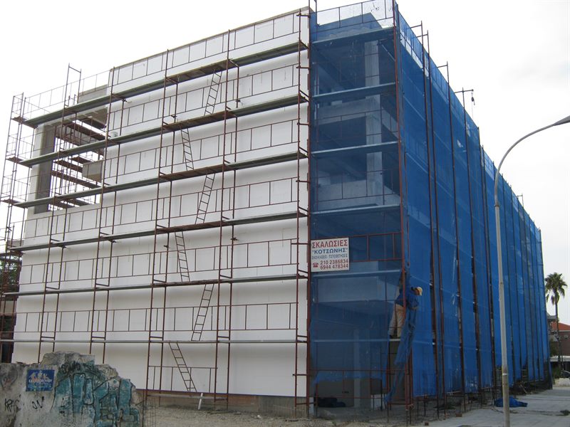 Scaffolding with blue safety netting on an apartment building