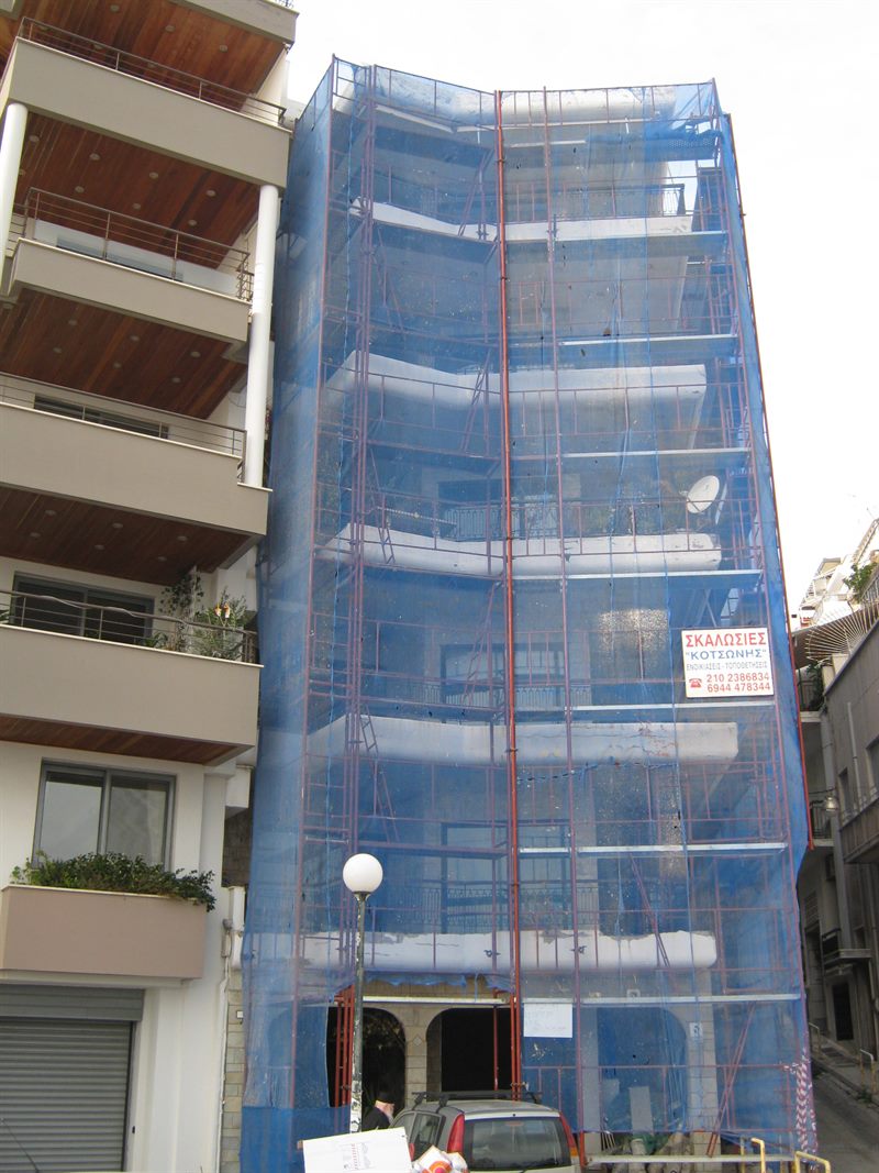 Scaffolding with blue safety netting on an apartment building