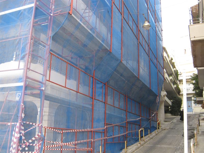 Scaffolding with blue safety netting on an apartment building