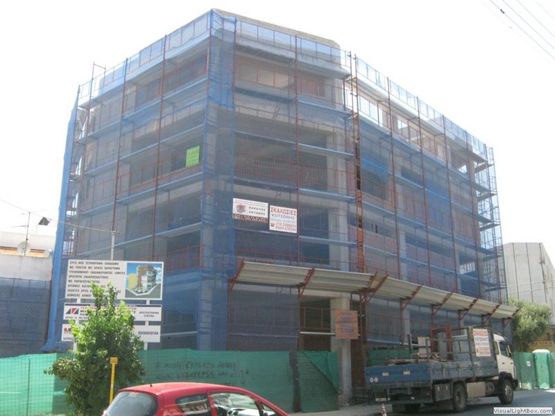 Scaffolding with blue safety netting on an apartment building