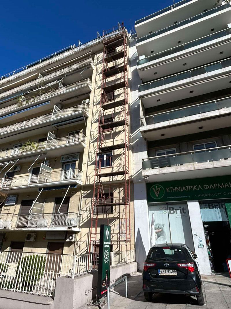 Scaffolding on a building with shops